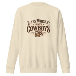Cream Likes Whiskey Loves Cowboys sweatshirt with vintage Western whiskey glass and cowboy hat graphic